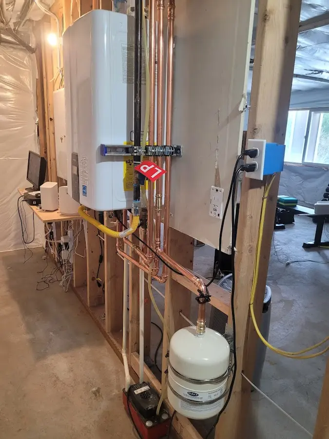 Licensed plumber repairing a kitchen sink in Ramapo