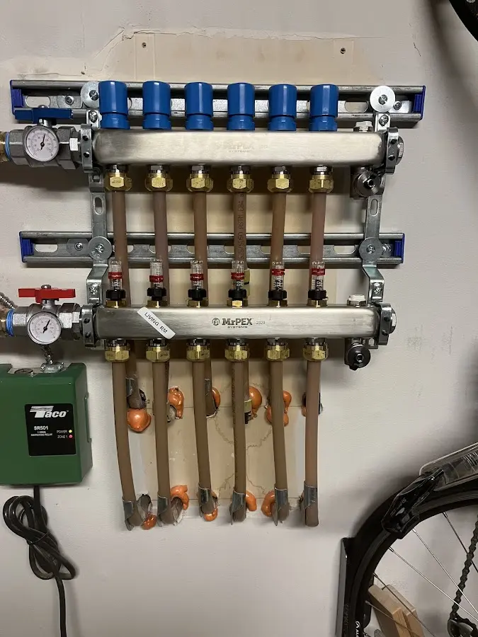 Plumber performing Water Heater Repair at a residential property in Ramapo